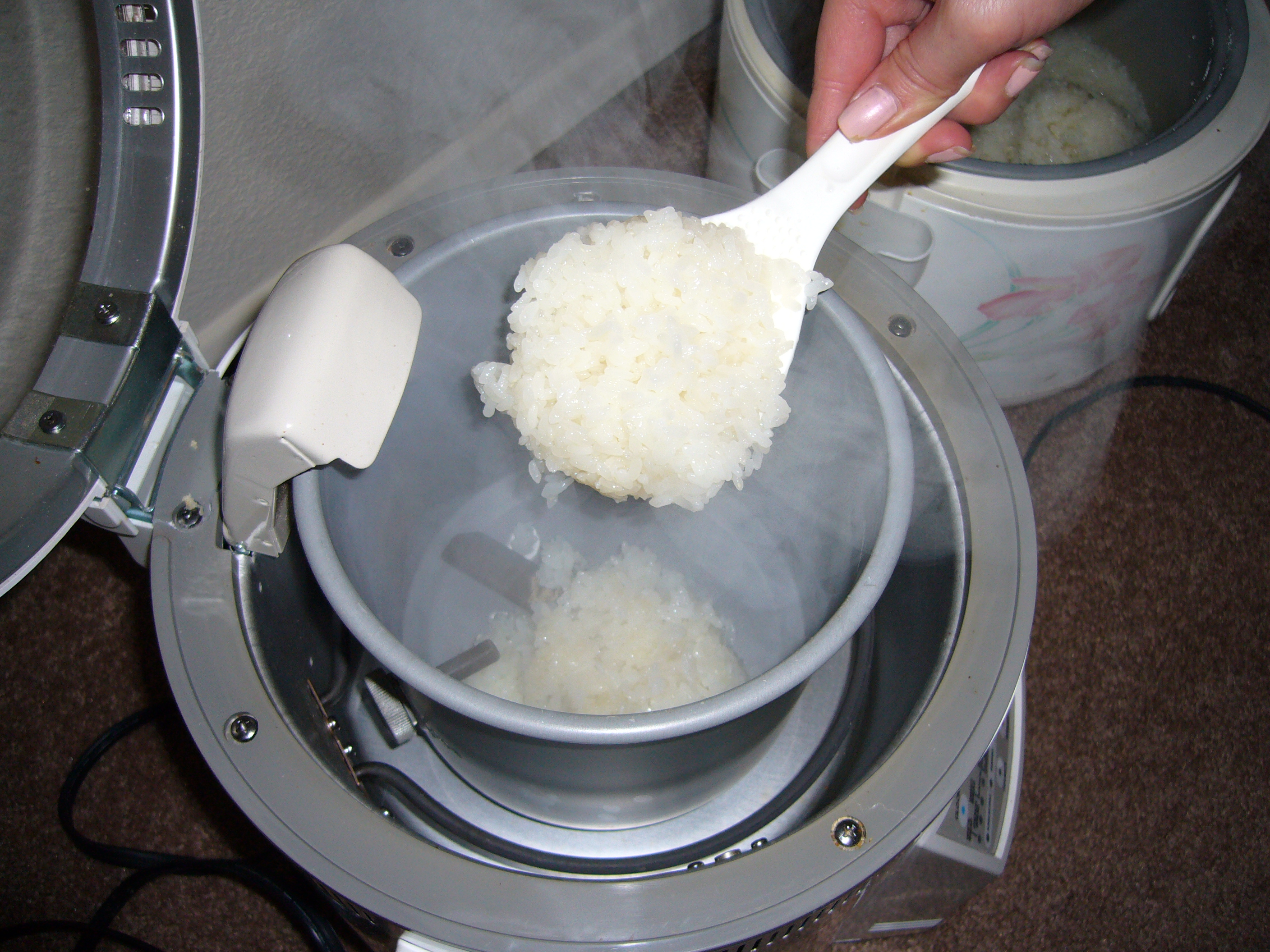 Mochi machine kneading rice into mochi 